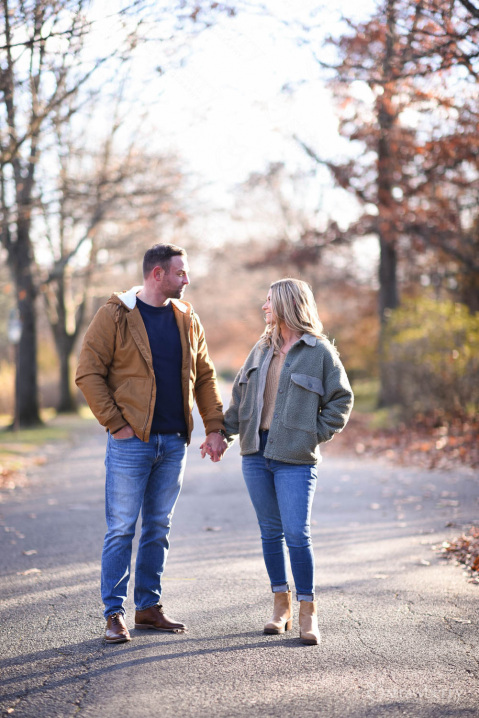 engaged-couple-stroll-park-path-autumn-1