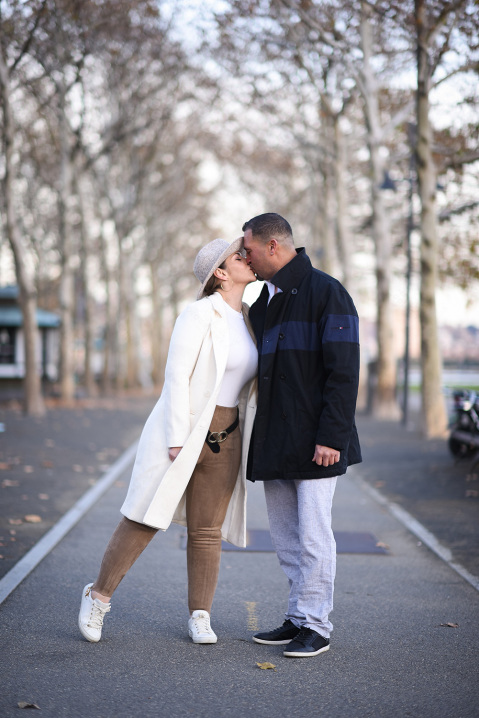 10-engaged-couple-kissing-riverside-park