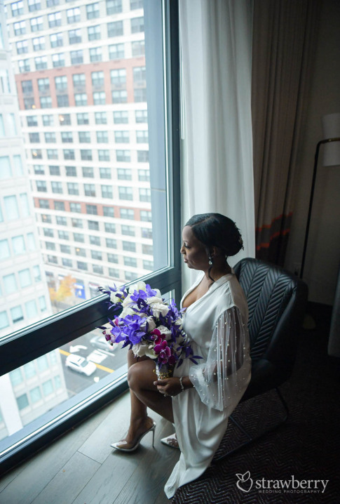 bride-with-violet-bouquet-by-window