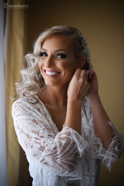 bride-preparation-earings-smile-portrait