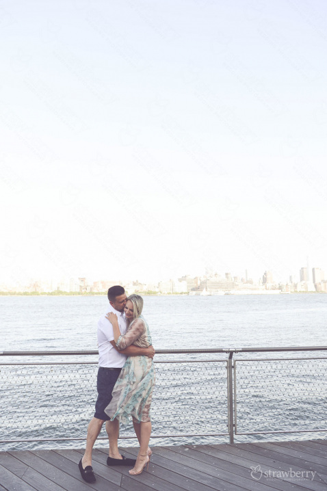 engaged-couple-embracing-beside-the-river-01