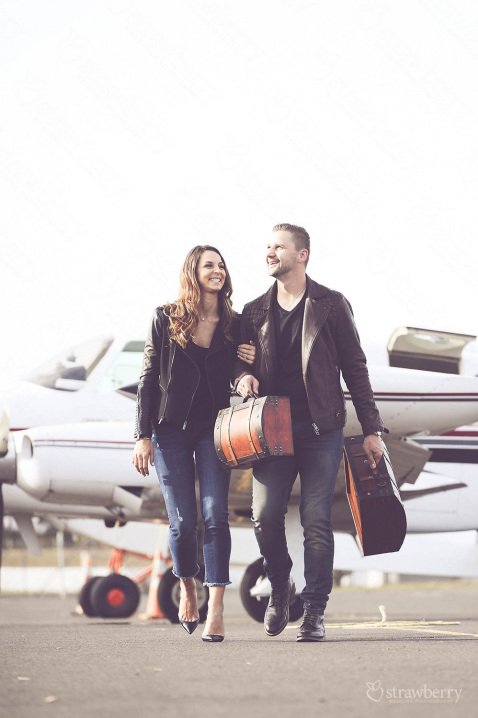 happy-couple-engagement-session-airport-suitcase-1