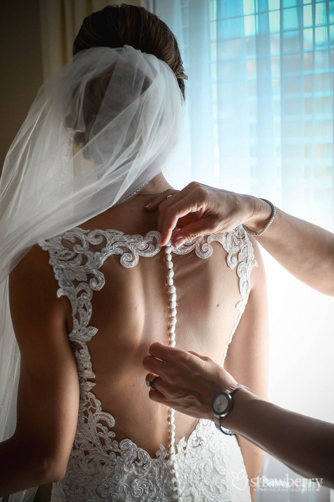 bride-preparation-close-up-on-wedding-gown