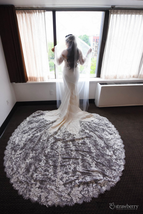 bride-standing-in-front-of-window