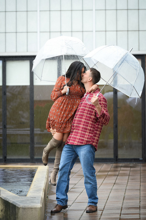 5-couple-love_flying-hug-rainy-day-engagement-session
